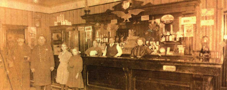 Old photo of people at a bar